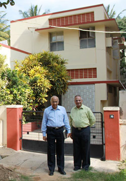 Zac Poonen and Ian Robson in front of 16 DaCosta Square